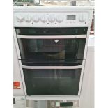 A Hotpoint electric glass top cooker.