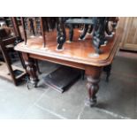 A 19th century mahogany wind out dining table with two extra leaves, length 151cm, width 121cm and