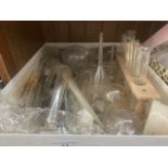 A collection of laboratory glassware, test tubes, glass funnels, flasks, etc.
