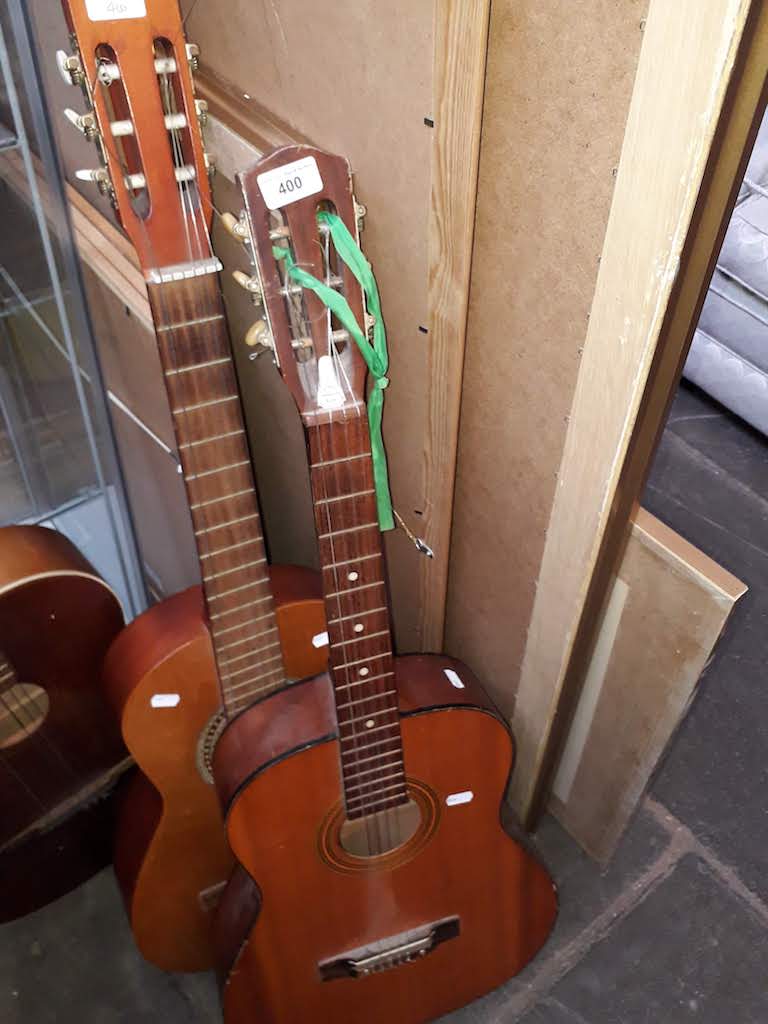 A Constanza Classic and one other acoustic guitars.