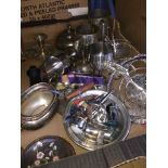 A box of silverplated items.