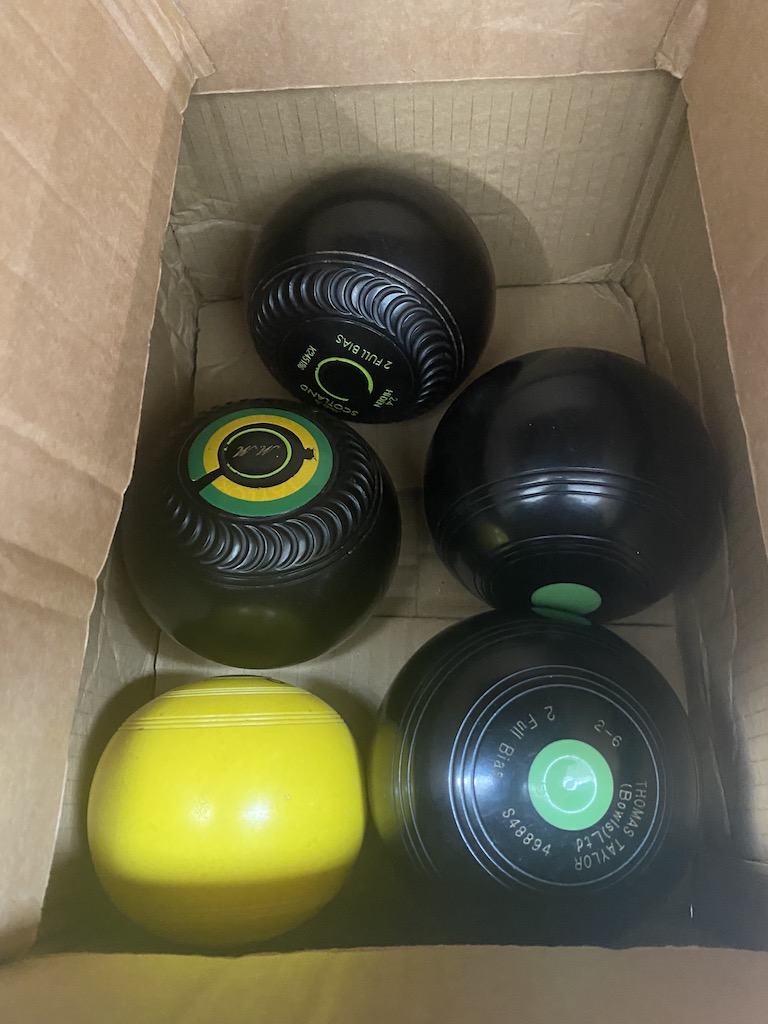 2 sets of crown green bowls and 1 jack - Thomas Taylor, etc.