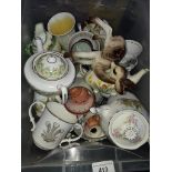 A misc box of china, tea pots, cups and saucers, Royal Albert "Violets", etc.