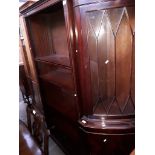 A large mahogany bookcase and a glazed mahogany corner unit