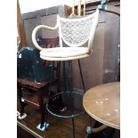 A 1960s retro cane bar stool.
