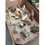 A box containing various Lilliput Lane figures, small animal figures including Border Fine Arts, and