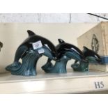 Set of three graduated Poole pottery dolphins