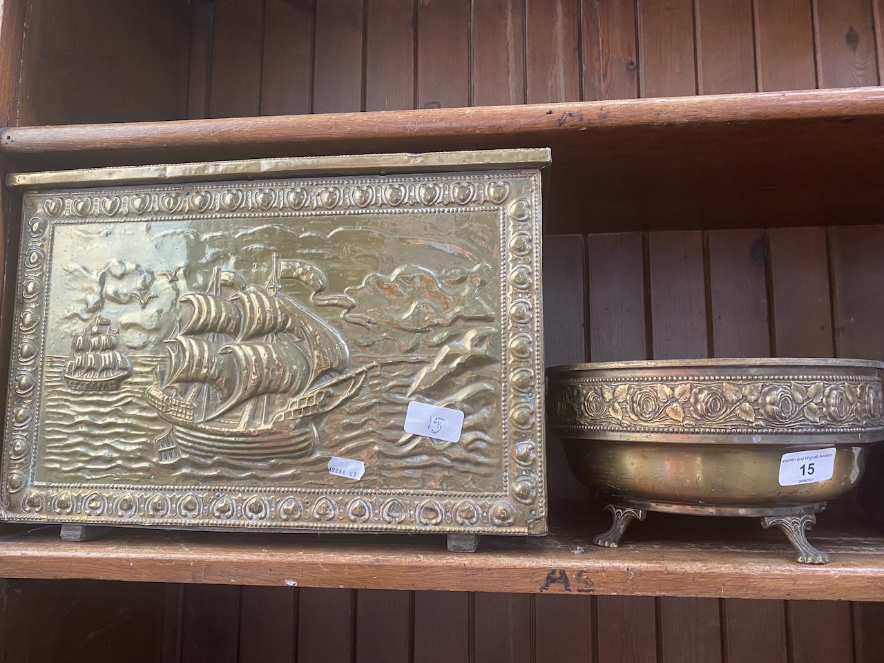 A brass bound coal box and a brass bowl on lion's feet.