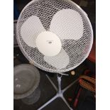 A pedestal oscillating fan.