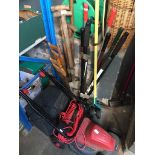 A Sovereign electric lawn mower, lawn edger, a lopper, spade, fork, couple of saws, Hozelock hose
