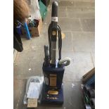 A Sebo Automatic X4 upright vacuum cleaner with accessories.