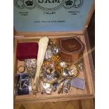 A cigar box with mixed vintage curios to include cufflinks, tiepins and various metal items