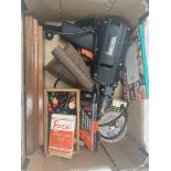 A box of miscellaneous to include electric drill with bits, playing cards, chess pieces, small glass