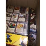 A box containing various trading cards, etc.