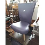 A modern purple upholstered chair and matching footstool, height 99cm, width 65cm and depth 65cm