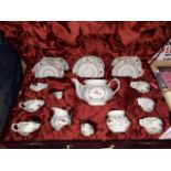 A lined burgundy velvet case containing Gural 6 piece tea set.