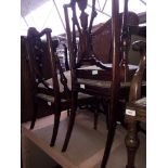 A set of four Edwardian chairs.