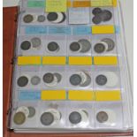 A coin album containing mainly GB, world 17th to 20th century coins & tokens, including shillings,