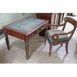 A Victorian mahogany two drawer library table together with a Regency mahogany armchair.