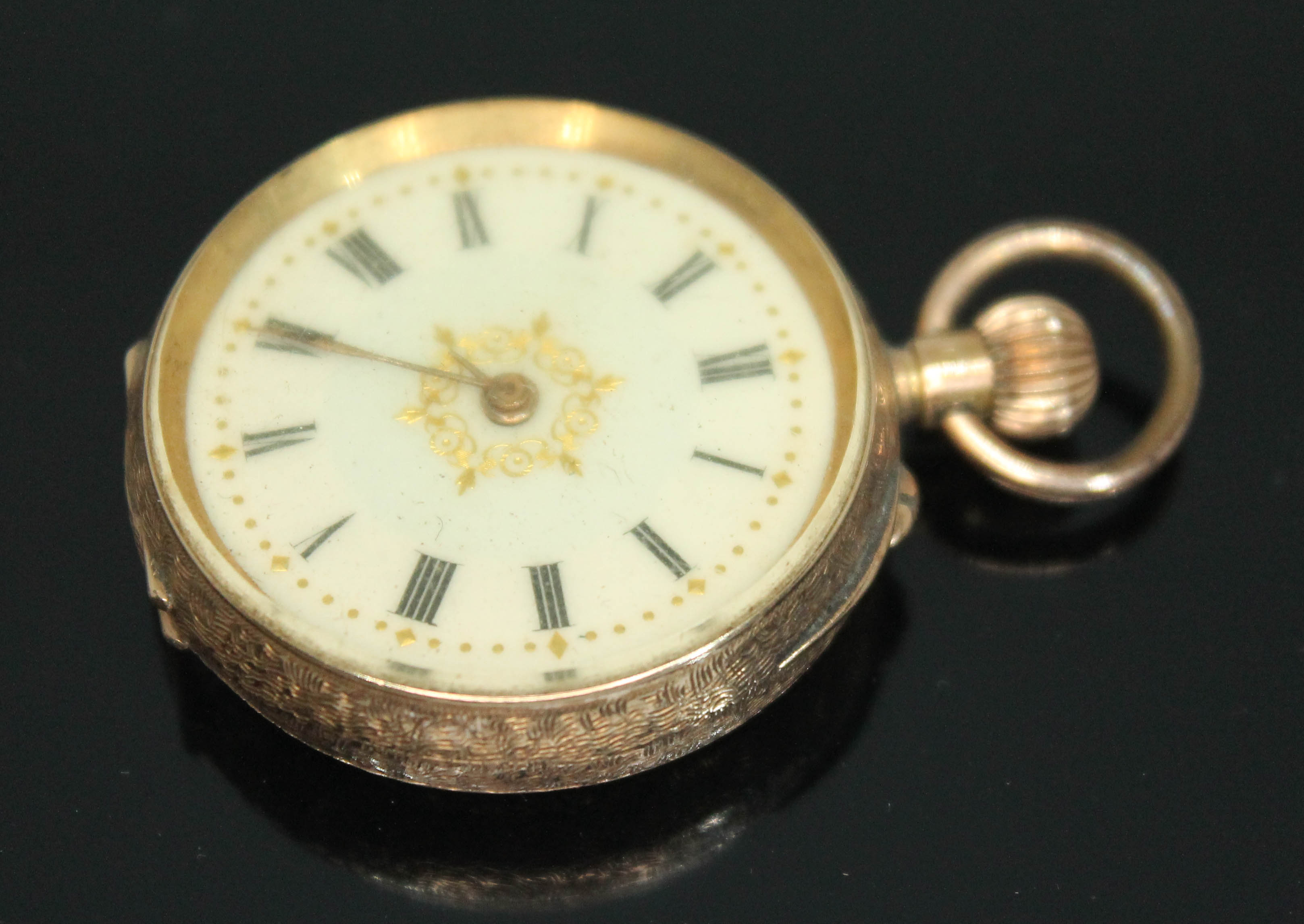 A late 19th/early 20th century Swiss 14ct gold ladies pocket watch having white enamel dial with