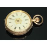 A late 19th/early 20th century Swiss 14ct gold ladies pocket watch having white enamel dial with