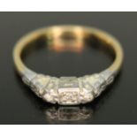 An Art Deco three stone diamond ring, marked '18ct&PL..', gross wt. 2.21g, size L.