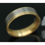 A yellow metal and titanium wedding band by Feniom, inverted D-section, marked 'Feniom', label