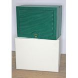 A Rolex green watch box with tag and outer cardboard box.