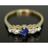 A five stone diamond and sapphire ring, the central stone weighing approx. 0.20 carats, total