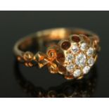 An antique 18ct gold diamond cluster ring,featuring nine Old European cut diamonds, the cluster