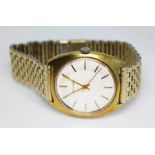 A 1960s gold plated Bulova wristwatch having signed silvered dial with gold tone hour markers and