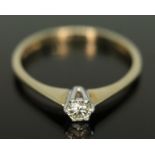 A hallmarked 9ct gold single stone diamond ring, the round brilliant cut diamond weighing approx.