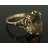 A gold ring set with an oval cut citrine, gross wt. 2.46g, size M. Condition - re-sized over
