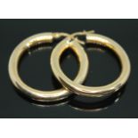 A pair of Italian loop earrings, marked '375', wt. 3.74g.