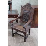 A 19th century carved oak Wainscot style armchair.