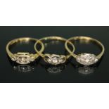 A group of three three stone diamond rings, all marked '18ct', gross wt. 4.73g, size M/O.