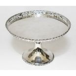 A George V silver cake stand, pierced rim, tulip pedestal, sponsor's mark indistinct, Birmingham