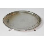 A George III silver dish tray of oval form and stood on four scroll feet, Crispin Fuller, London