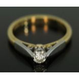 A hallmarked 18ct gold diamond solitaire ring, the modern round brilliant cut stone weighing approx.