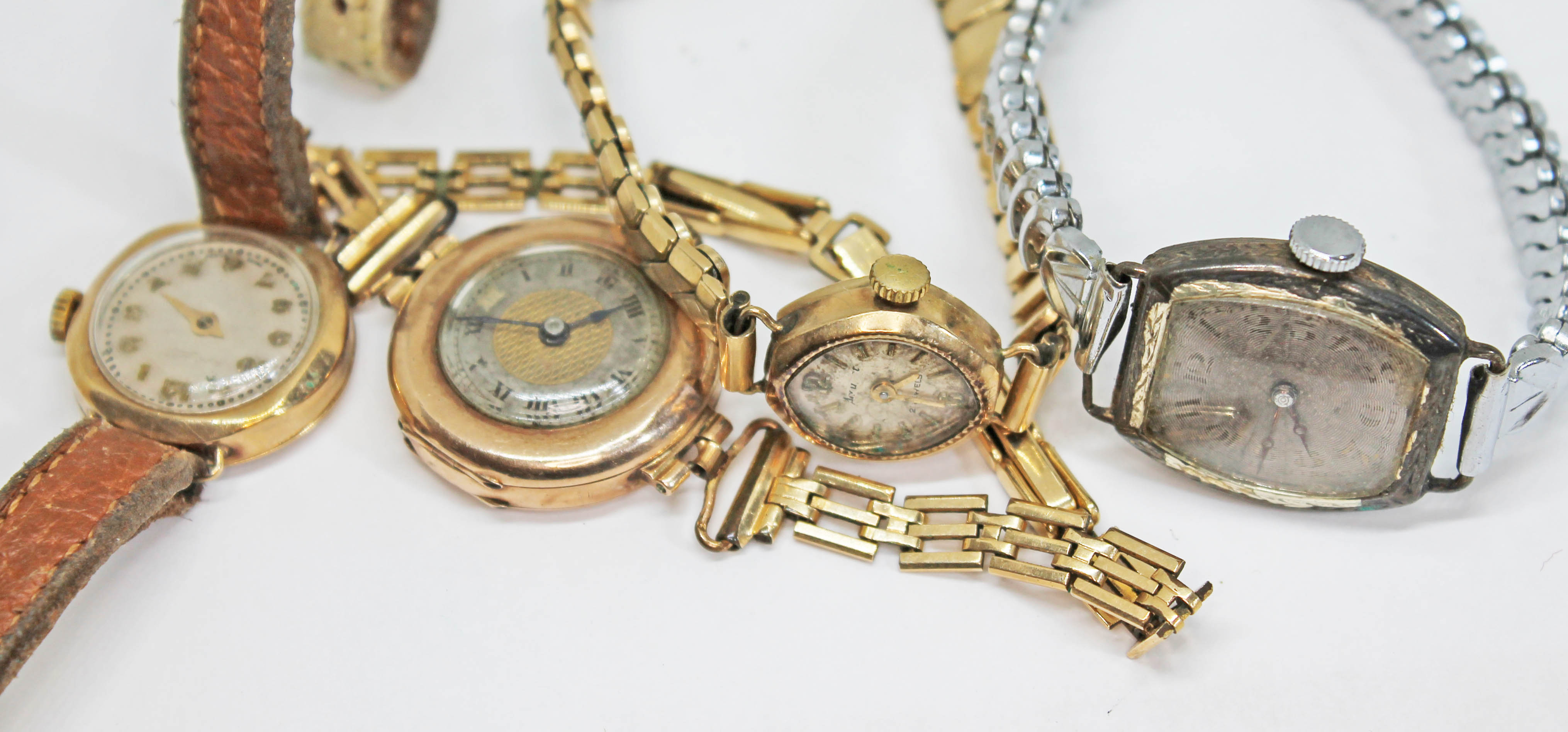 Four early to mid 20th century ladies mechanical wristwatches comprising three hallmarked 9ct gold