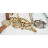 Four early to mid 20th century ladies mechanical wristwatches comprising three hallmarked 9ct gold
