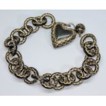 A Victorian pique inlaid tortoiseshell bracelet with heart shaped drop, length 20cm. Condition -