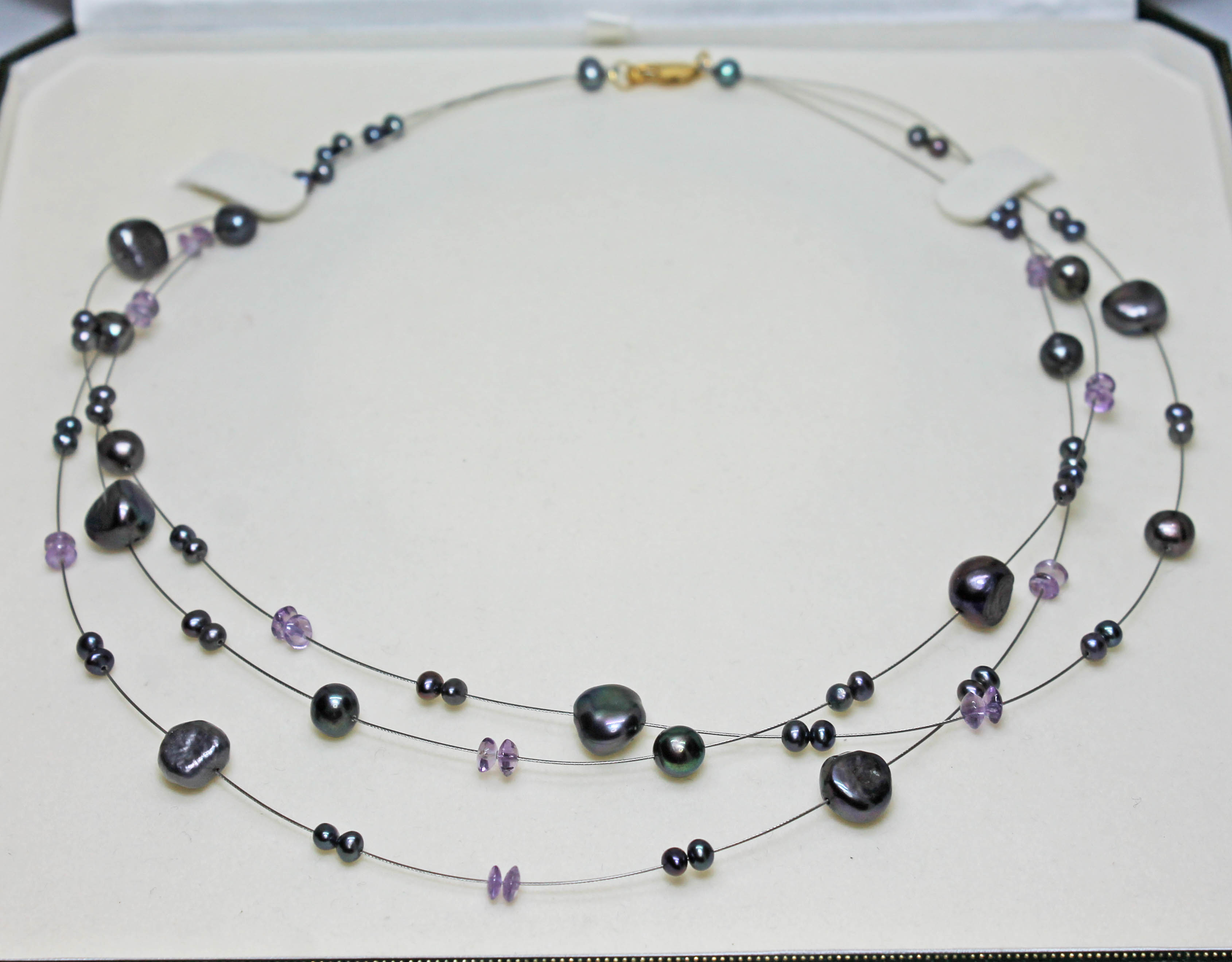 A modern three wire strand beadless cultured pearl and amethyst choker necklace with clasp marled '