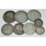 A group of silver coins comprising three crowns, three half crowns and two shillings.