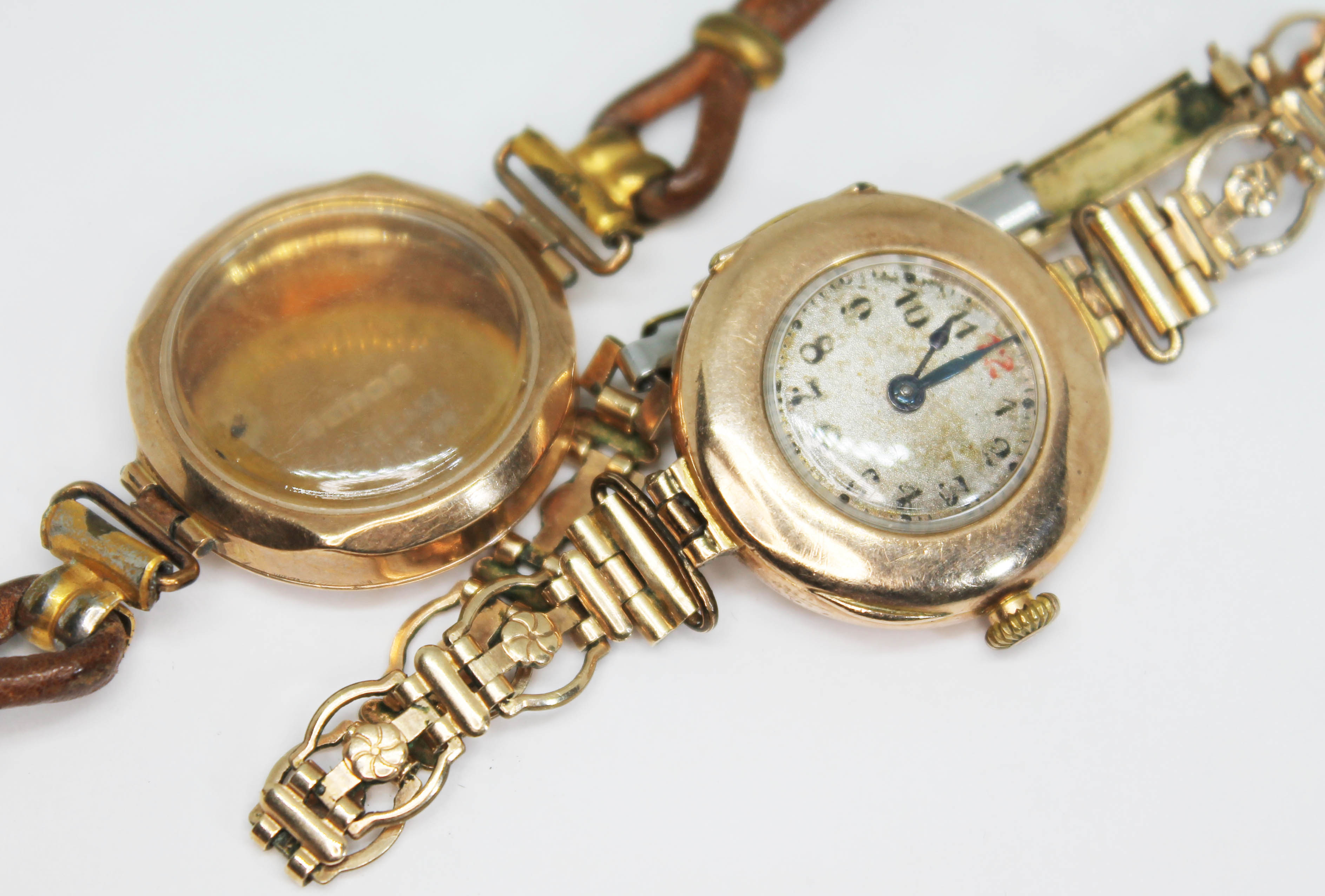 An early 20th century hallmarked 9ct gold ladies wristwatch on rolled gold strap, together with an