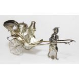 A Chinese novelty cruet modelled as a man pulling cart, marked 'L.H.K.' within a fish, also with