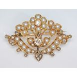 A Victorian split pearl and diamond brooch of floral form, the central Old European cut diamond