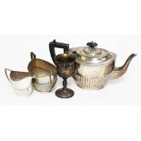 A matched three pieces hallmarked silver tea set and a silver goblet, gross wt. 34 1/3oz.