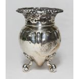 A late Victorian/Edwardian silver vase, pierced rim, three scroll feet, Goldsmiths & Silversmiths