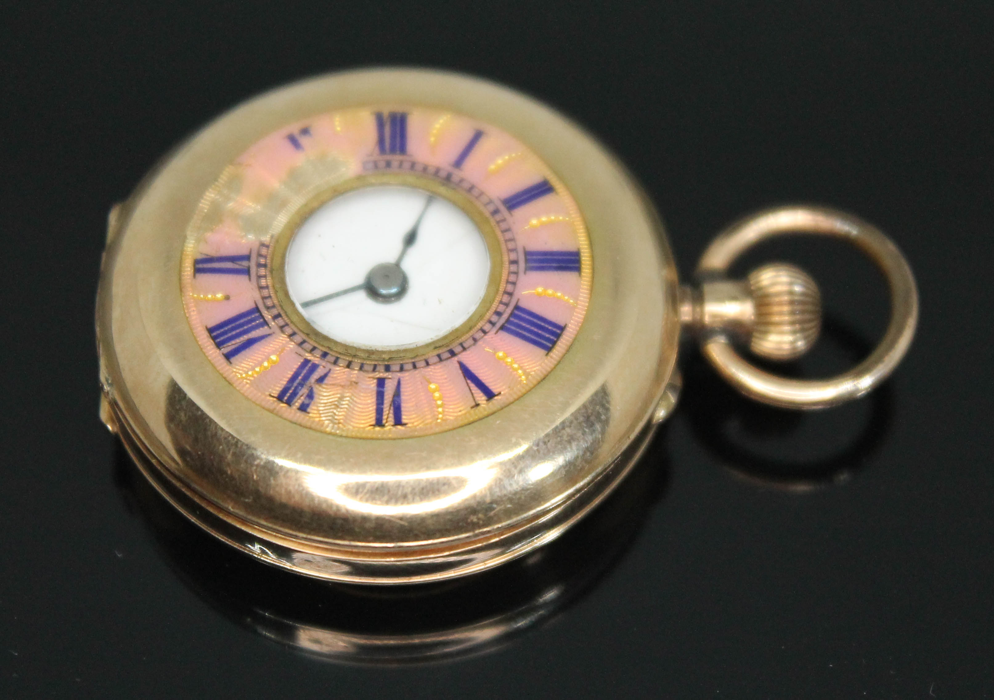 A continental 14ct gold half hunter ladies pocket watch having white enamel dial with Roman